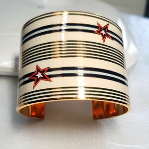 TORY BURCH Chic Gold Cuff with Black Stripes and Red Stars